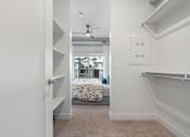 Thumbnail 20 of 26 - A bedroom with a bed and a window.