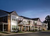 Thumbnail 4 of 5 - a row of town houses with street lights