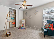 Thumbnail 17 of 27 - Spacious room with ceiling fan and built in storage at The Colony Apartments, Universal City, Texas