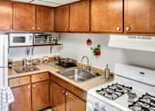 Thumbnail 4 of 10 - Kitchens provide plenty of storage and spacious countertop space.