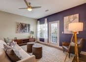 Thumbnail 8 of 21 - Living room area with tables, couches, chair at Ascent at Mallard Creek Charlotte, NC
