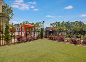 Thumbnail 21 of 21 - Outdoor area. Fenced in pool, big grass area outside of pool, and cabanas inside pool area at Ascent at Mallard Creek Charlotte, NC