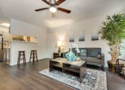 Thumbnail 1 of 42 - Modern Living Room at Wildwood Apartments, CLEAR Property Management, Texas