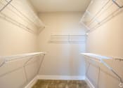 Thumbnail 5 of 13 - Master Bedroom Walk In Closet