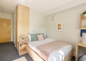 Thumbnail 8 of 8 - a bedroom with wooden furniture and a white bedspread