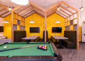 Thumbnail 4 of 8 - a games room with a pool table and tv