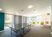 Thumbnail 4 of 8 - a room with a ping pong table