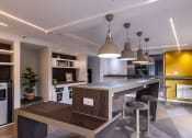 Thumbnail 6 of 8 - a kitchen and dining area in a modern apartment