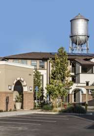 A large building with a water tower on top of it.