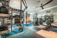 free weights and other exercise equipment in the fitness room