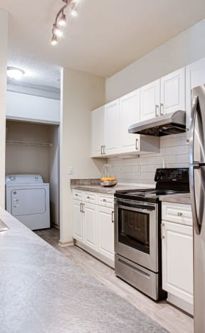 a kitchen with a large island with a bunch of plates on it