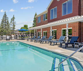 A 4ft pool outside a brick and red building