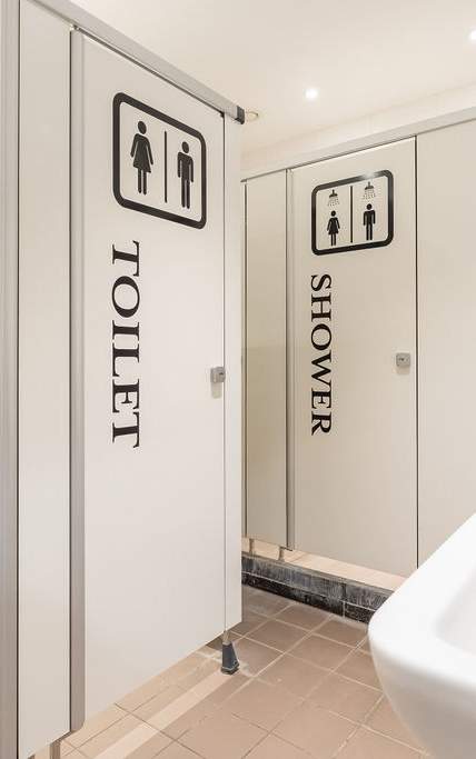 a white bathroom with a sink and a toilet