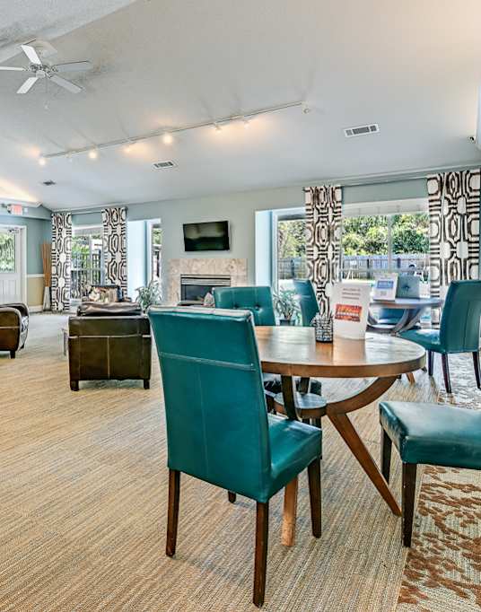 A room with a table and chairs in it.