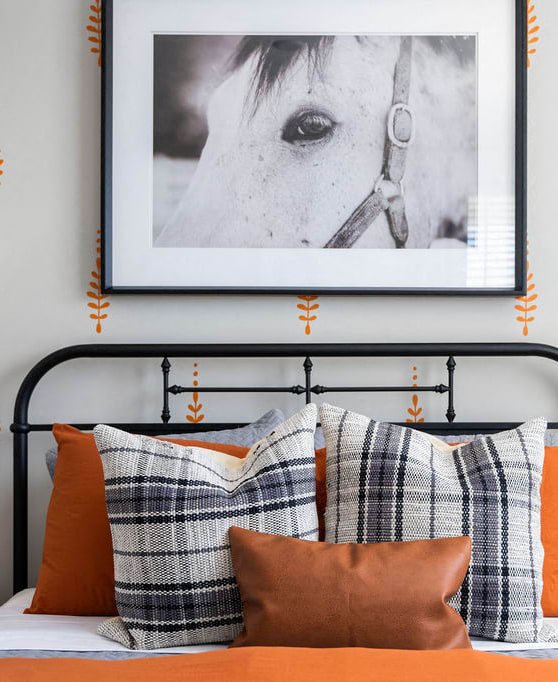 a bedroom with a bed with pillows and a picture of a horse at Madison Prickett Preserve, Yardley