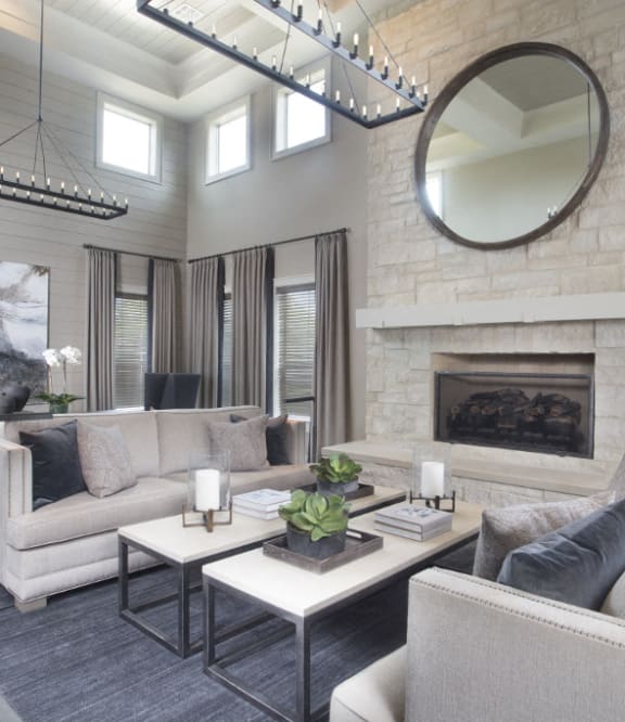 a living room with three mirrors and a wood floor