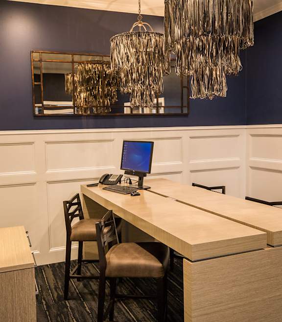 A room with a desk and a chair.