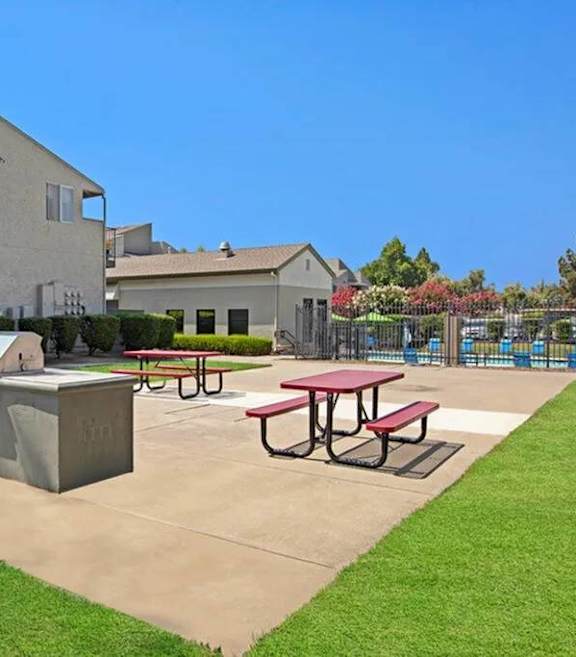 A concrete picnic table sits in a concrete courtyard at The Henley Apartments, Suisun City, CA
