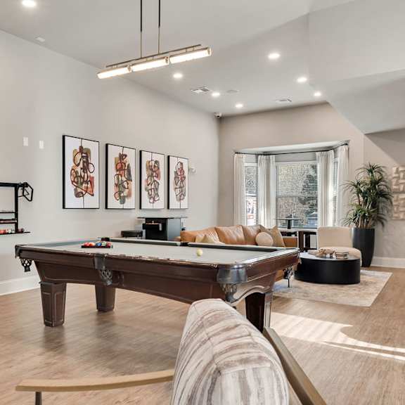A living room with a pool table and a couch at Echo at Lake Norman, Mooresville, NC