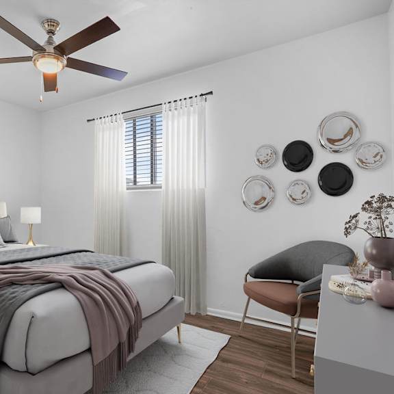 a bedroom with a bed and a ceiling fan