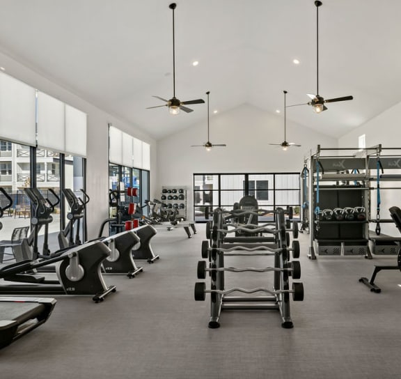 a pair of blue shoes next to dumbbells and weights at Seasons at Meridian, Meridian, ID, 83642