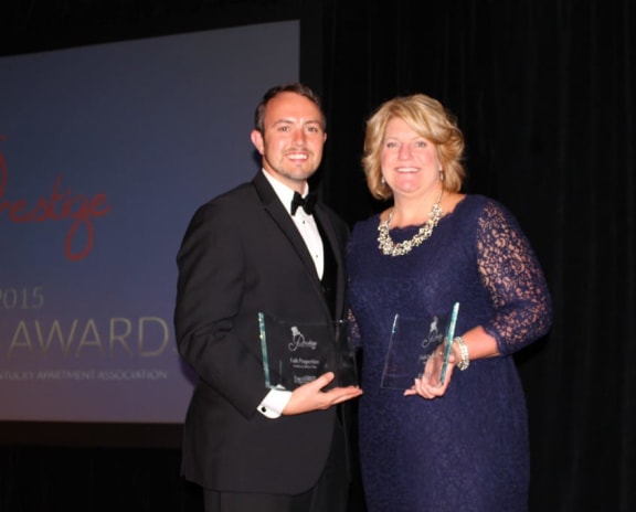 person receives an award from person