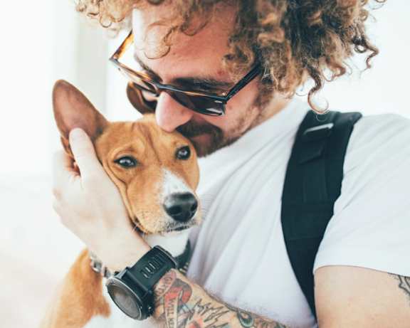 a man holding a dog