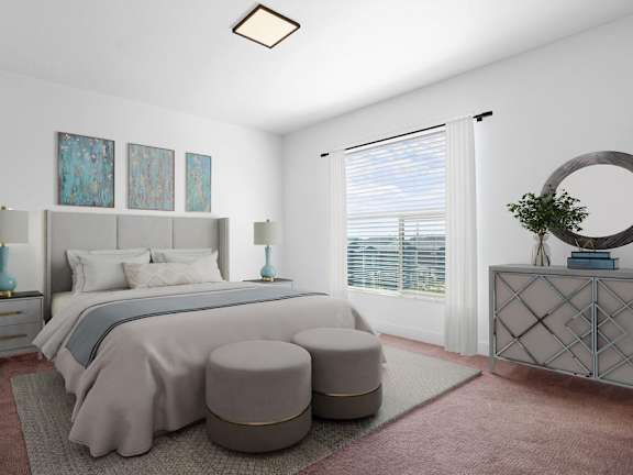 A bedroom with a large bed and a round mirror on the dresser.