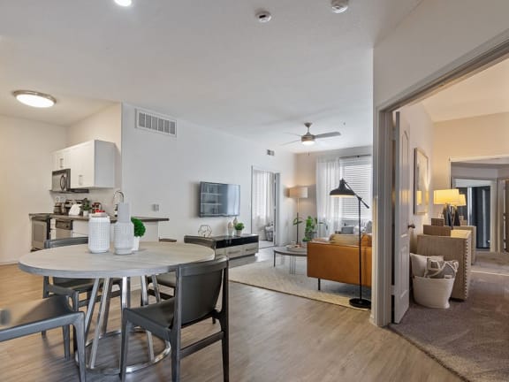 a living room and dining room with a table and chairs at Element Deer Valley in Arizona 85027