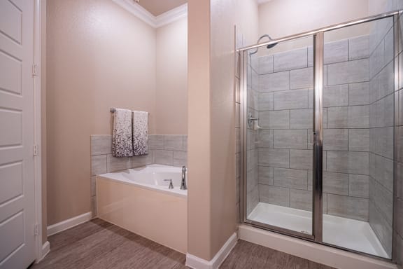 Bathroom facing soaking tub and stand up shower