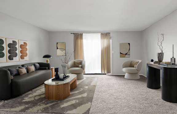 A modern living room with a grey sofa, a wooden coffee table, and a large window with curtains.