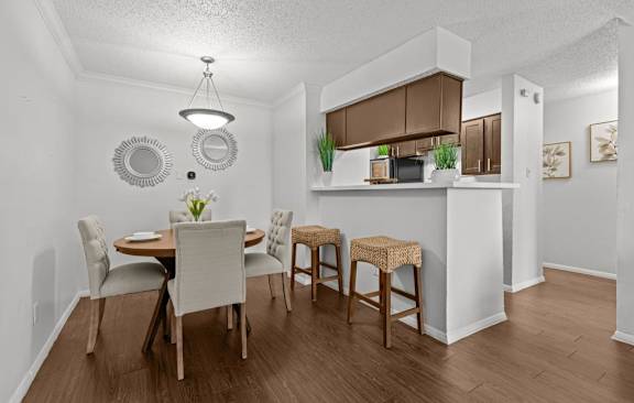 A kitchen with a black stove top oven and a black dishwasher.
