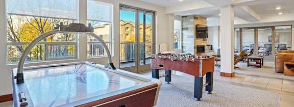 a bedroom with a bed and a bathroom with a toilet and a sink