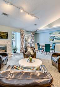 Bright Living room with Fireplace at Springwood Townhomes, Tallahassee, FL