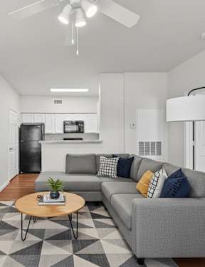 the preserve at ballantyne commons apartment kitchen with black appliances and white cabinets
