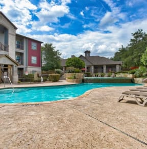 a swimming pool with beach chairs