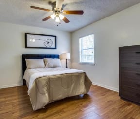 bedroom with a bed and a ceiling fan at THE EASTWOOD, AUSTIN, TX 78705