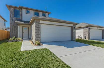 a house with a white garage door and a driveway