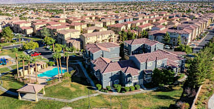 A large residential area with houses and a pool.