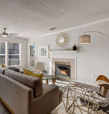 a living room with a fireplace and a couch