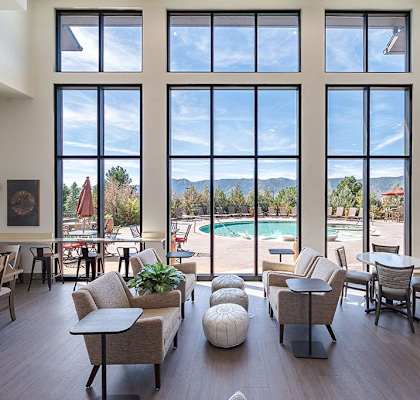Clubhouse with view out of huge wall of windows at Vistas at Jackson Creek, Monument, Colorado