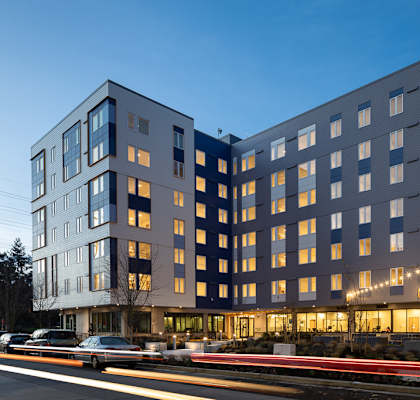 a large building with a street in front of it at The Aries at Bitter Lake Apartments, Seattle