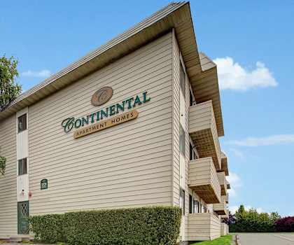 The exterior sign and building of Continental Apartment Homes. 