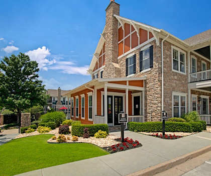 A large two-story house with a red and white exterior.