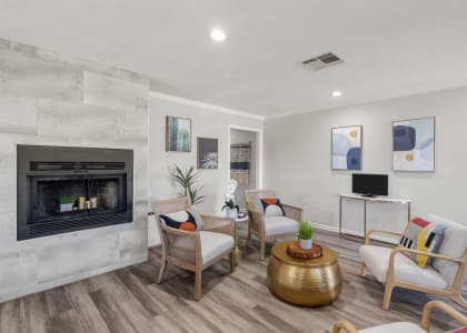 a living room with a fireplace and a tv at Aspire Rialto, Rialto, 92376