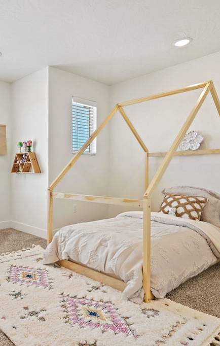 a bedroom with a bed and a desk