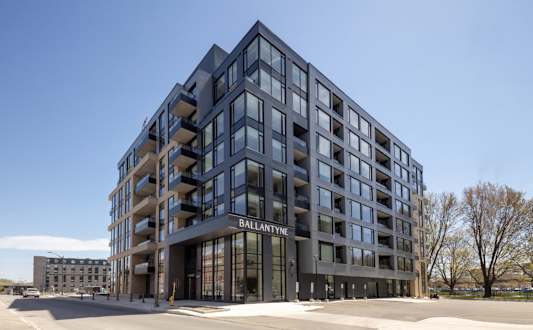 A modern building with the name "BALLANTYNE" on the front.