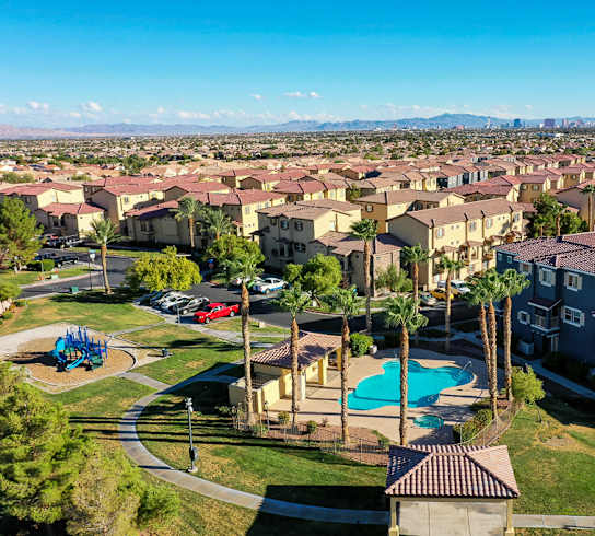 A large residential complex with a pool and playground.