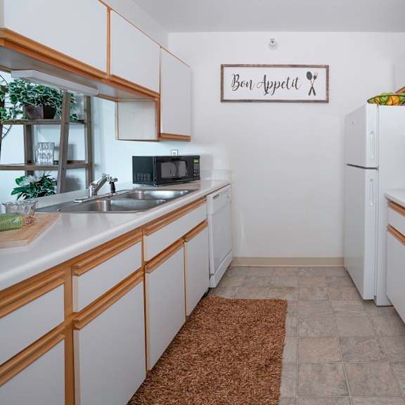 a bathroom with a sink and a toilet and a shower