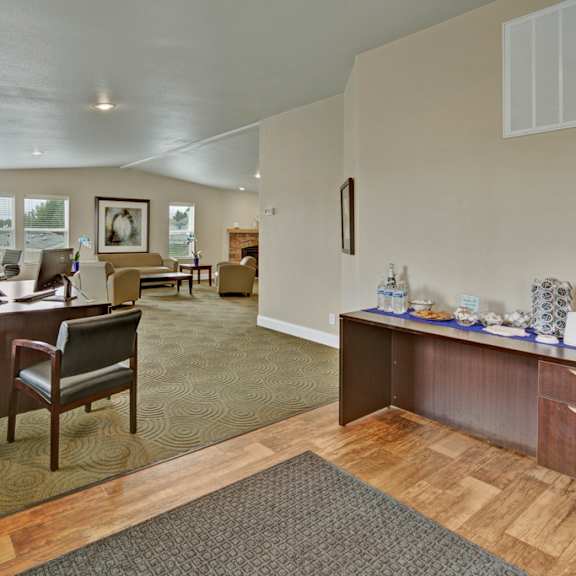 Four Seasons Apartments clubhouse with a dining area and a bar and a living room